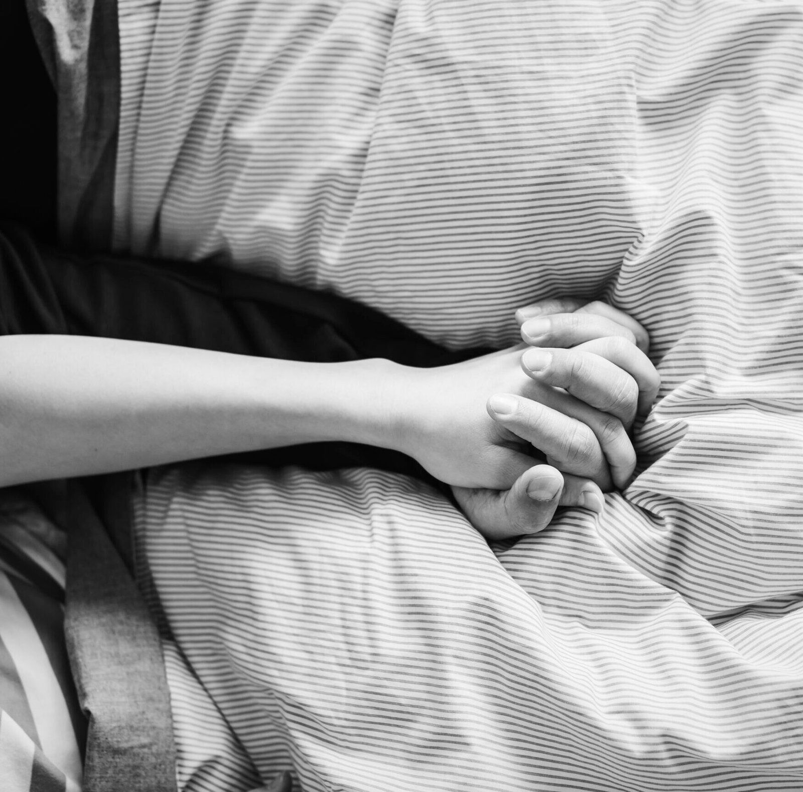 closeup of couple holding hands